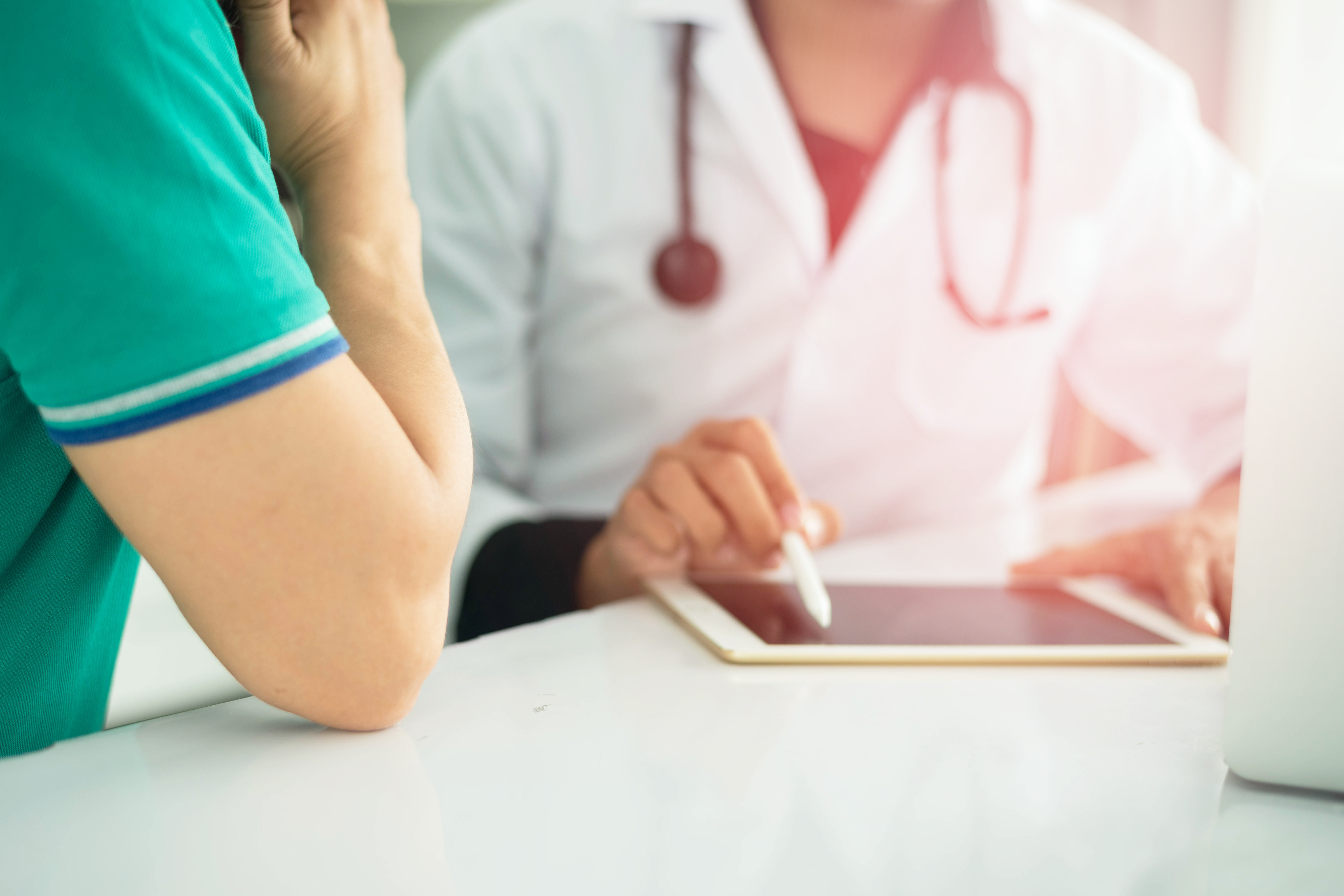 Physician visiting with a patient