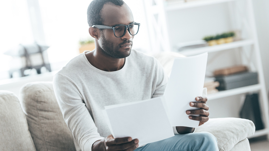 A man reading his EOB