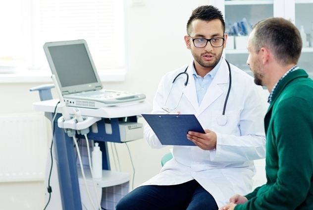 Man visiting male doctor in office