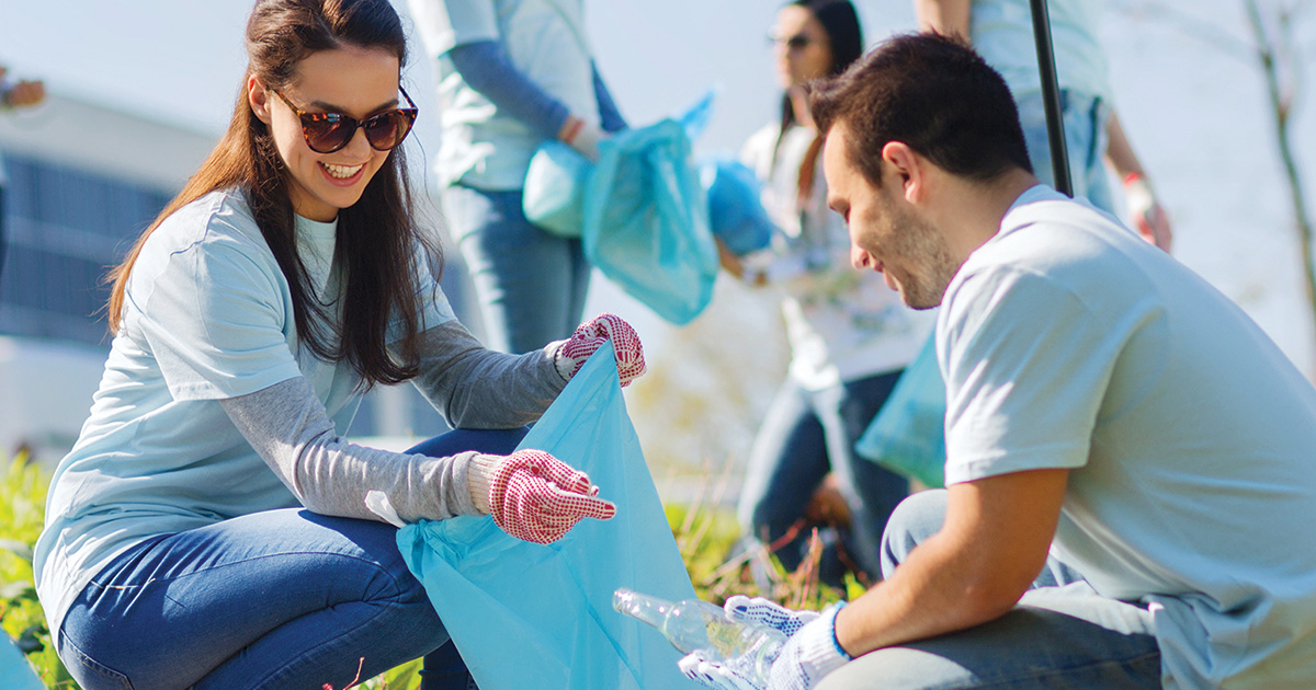 Couple picking up trash together