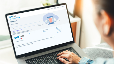 Individual on laptop logging into the provider portal.