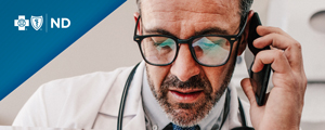 A doctor speaking on a mobile phone