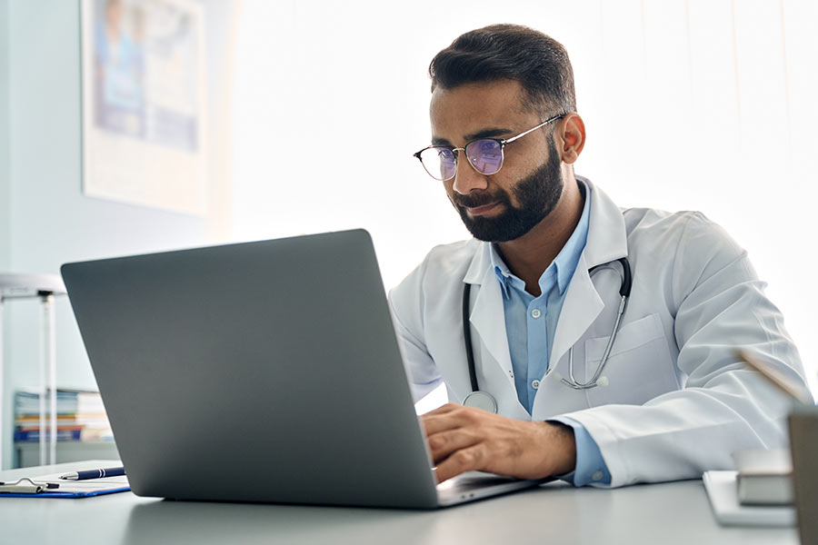 Physician using a laptop