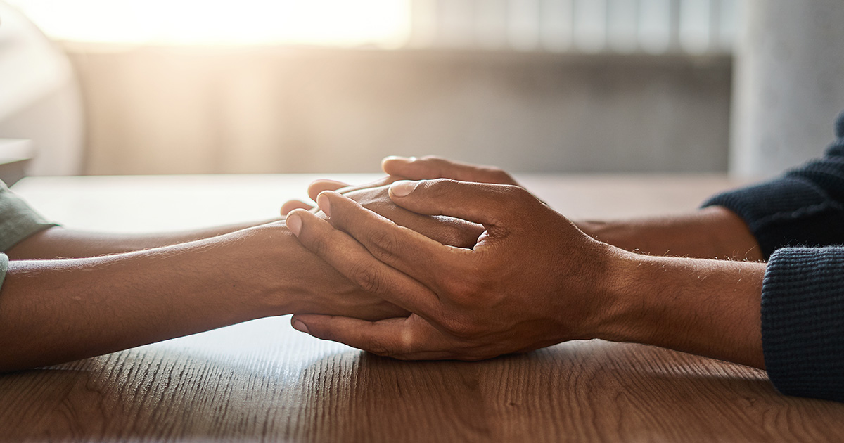 holding hands across the table