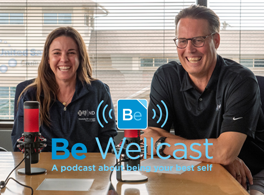 Pete and Elizabeth recording a new episode of the Be Wellcast.