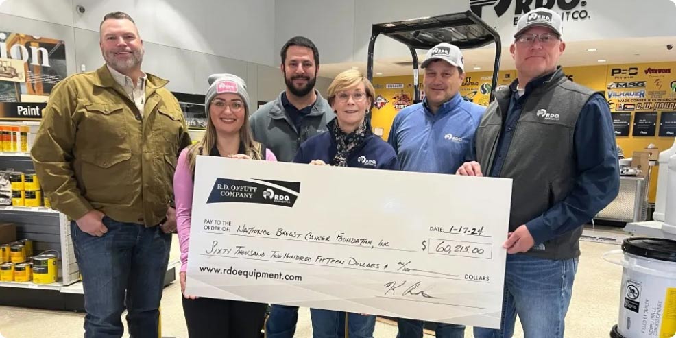 RDO employees present a donation to National Breast Cancer Foundation