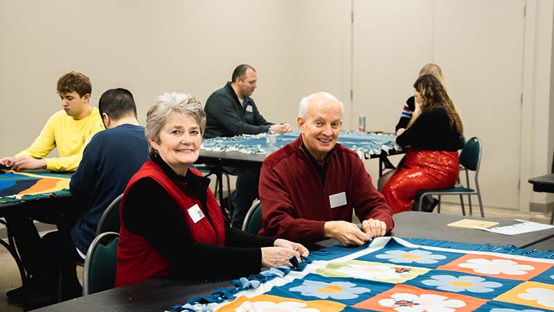 West Acres Development team making tie blankets