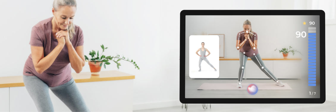 A woman doing physical therapy exercises with an online instructor