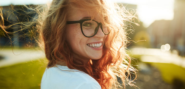 Smiling woman looking back over her shoulder