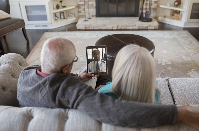 Older couple using telehealth on a tablet