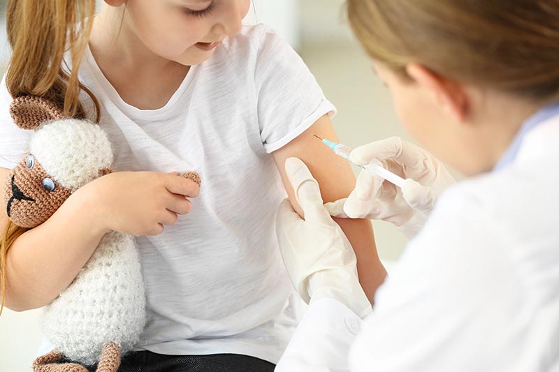 Child being vaccinated by a doctor
