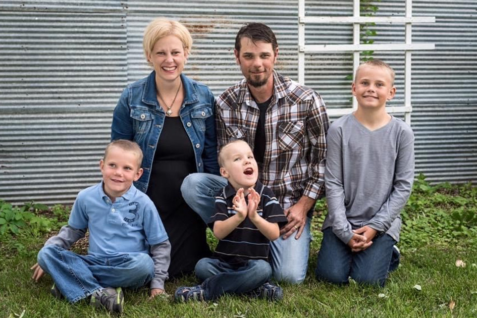Griggs family of 5 in front of a farm bin in Fargo, ND. 