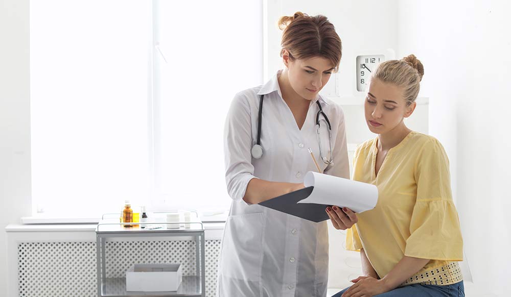 Patient having appointment with doctor in hospital