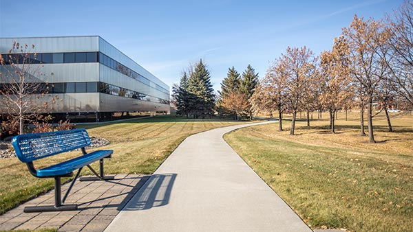 BCBSND Headquarters building exterior with walking path