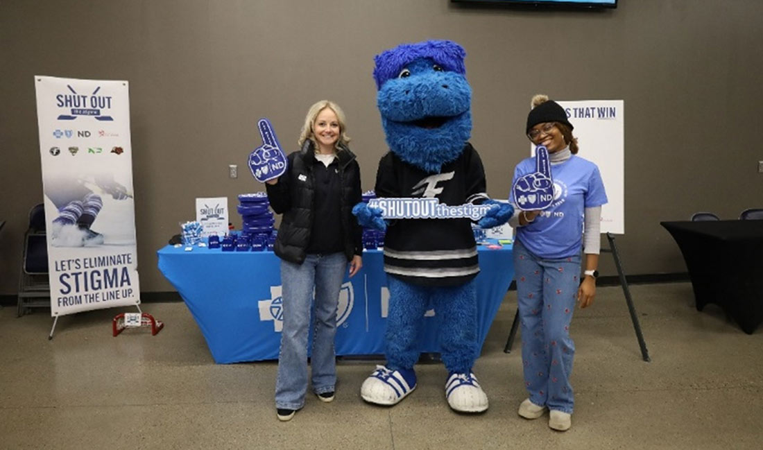 Shut out the Stigma table at hockey game with mascot
