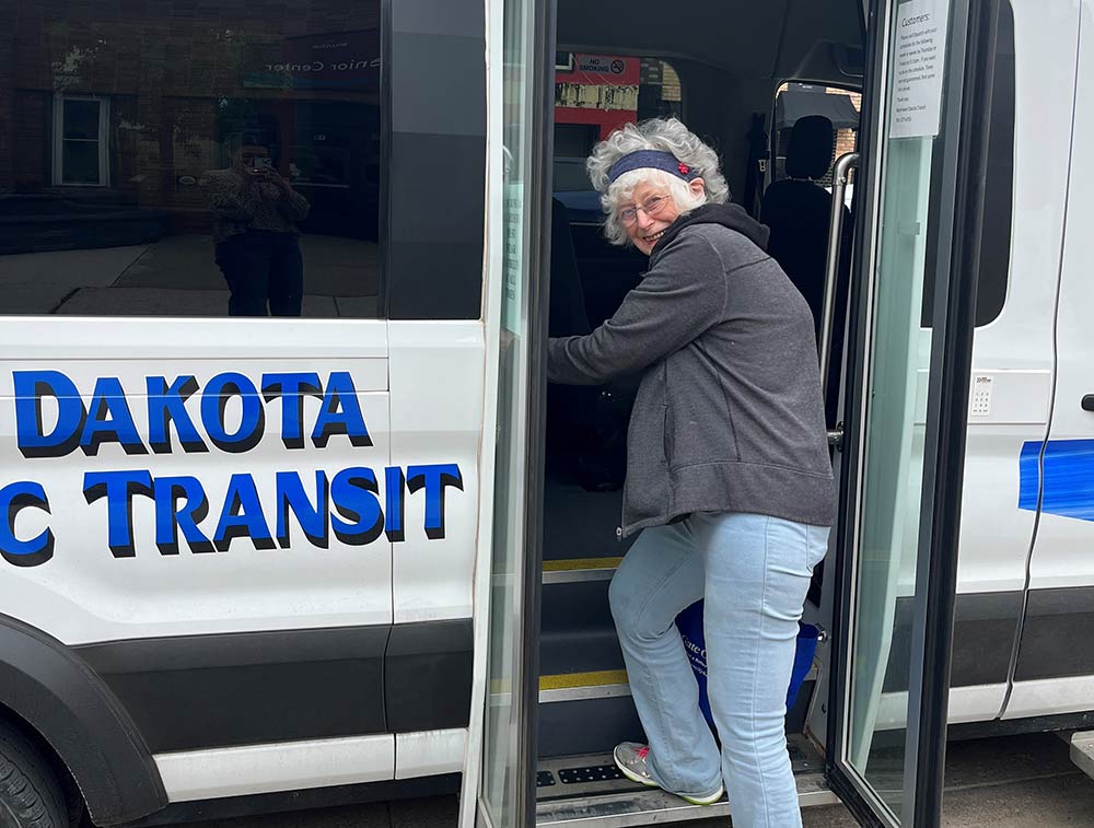 Woman boarding a bus