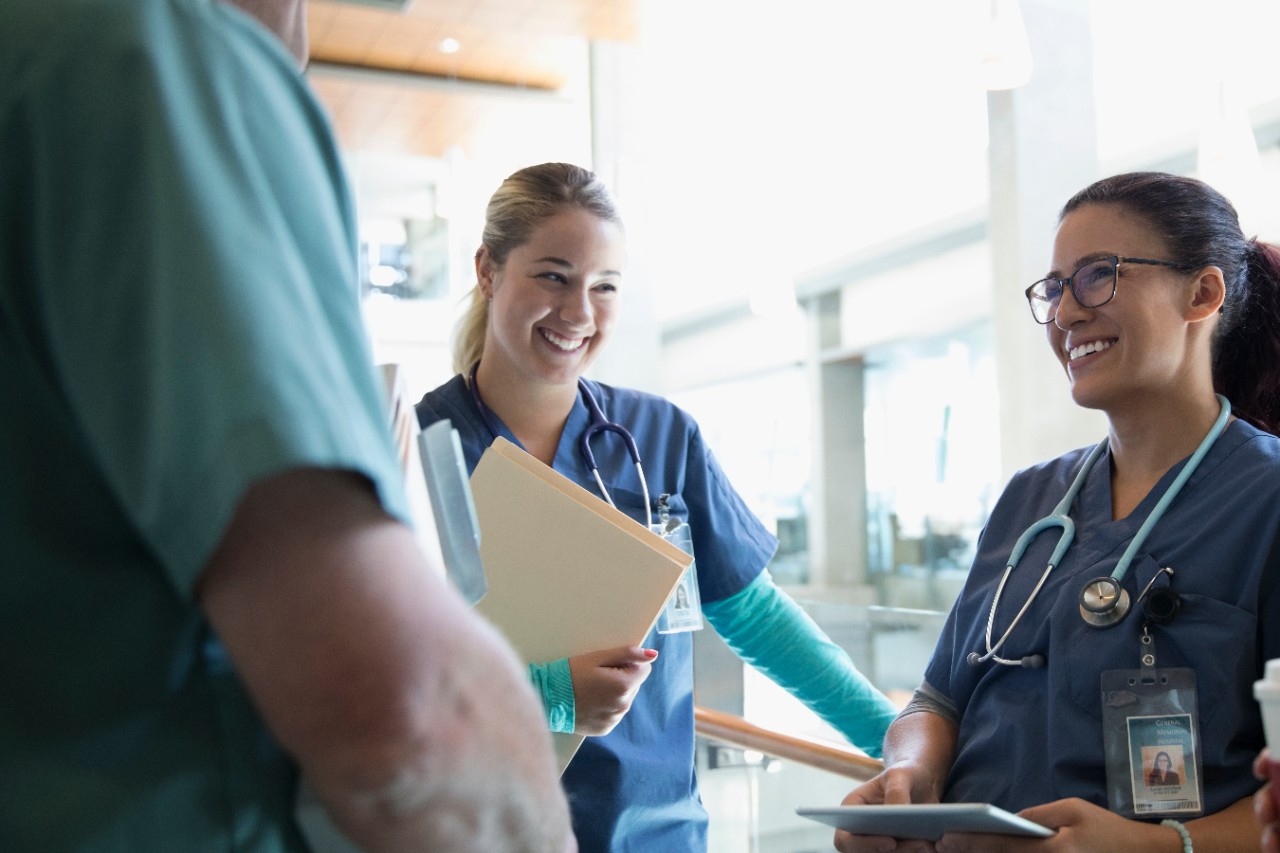 Female nurses laughing in hospital