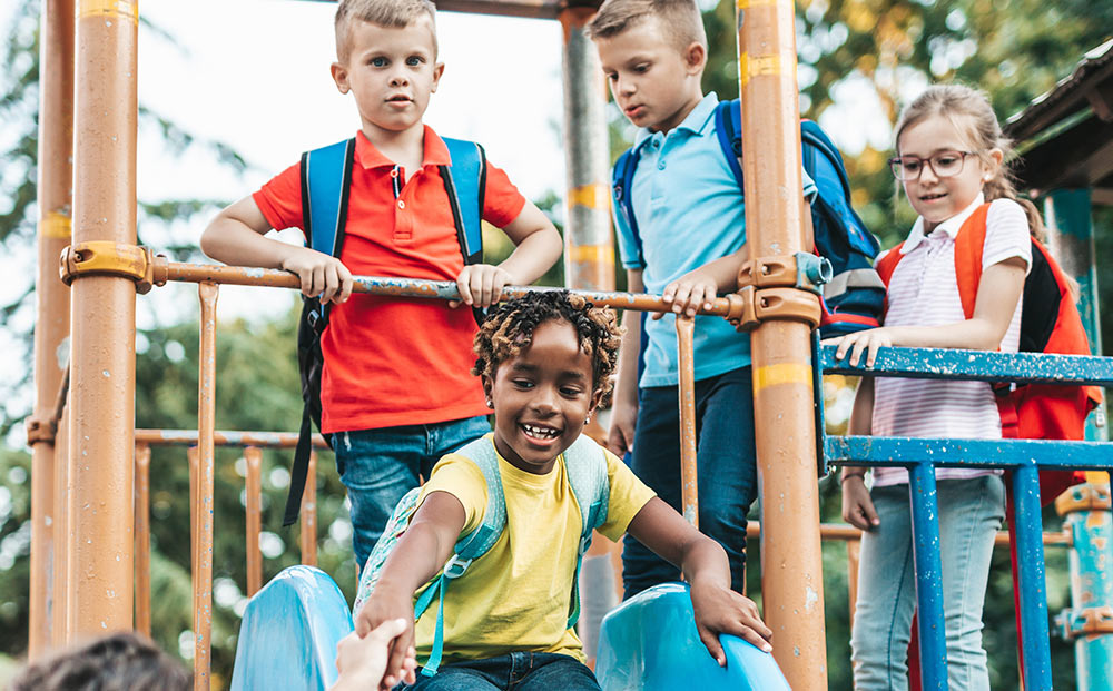 children playing on playground slide