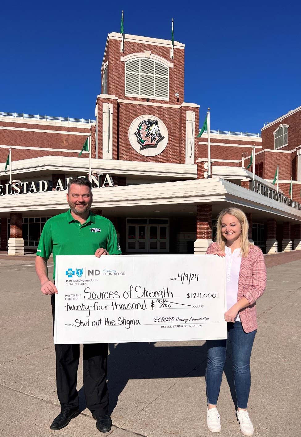 Check Presentation with UND Fighting Hawks and BCBSND Staff