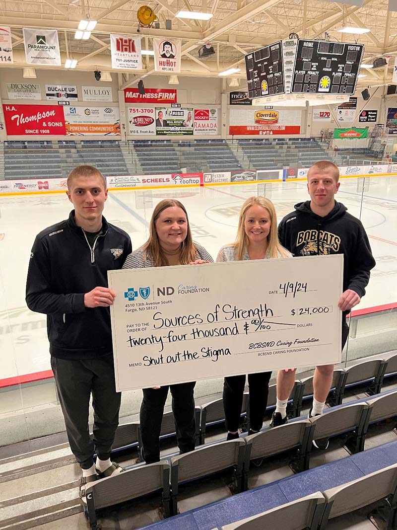 Check Presentation with Bismarck Bobcats Goalies and BCBSND Staff