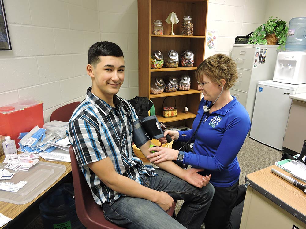 Rolette County Public Health taking blood pressure