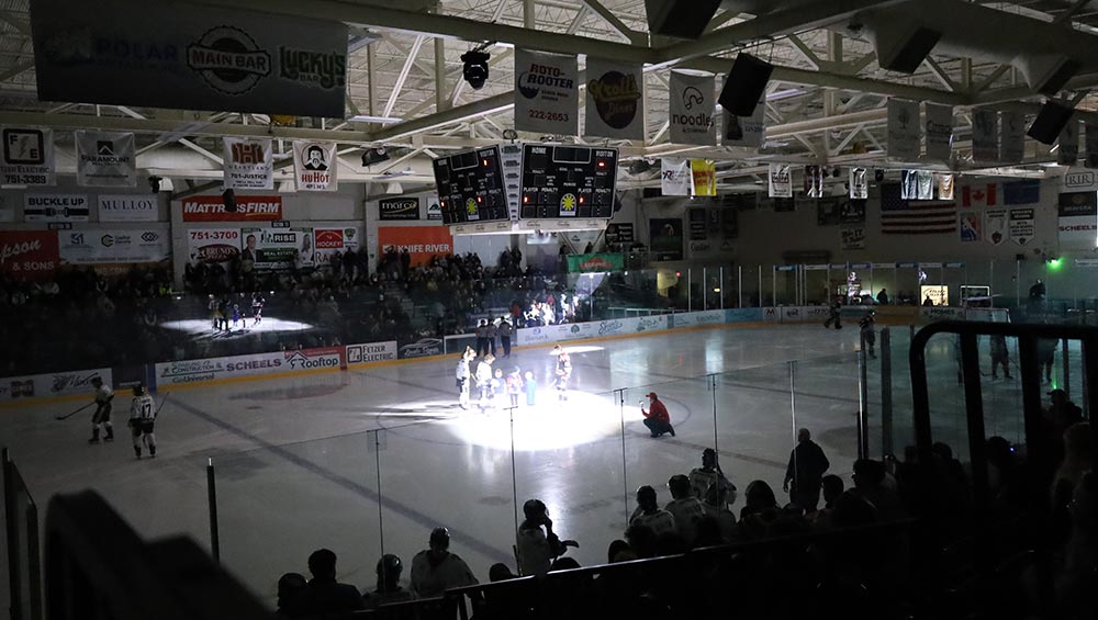 Bismarck Bobcats Shut Out the Stigma Game puck drop with family member of BCBSND teammate