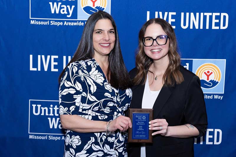 BCBSND employees accepting an award from United Way