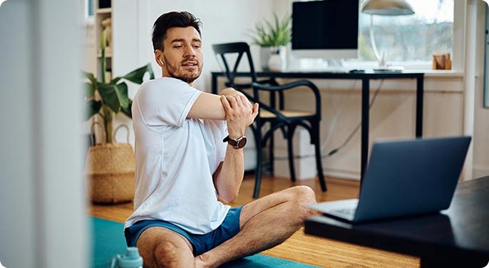 A man doing stretching exercises at home