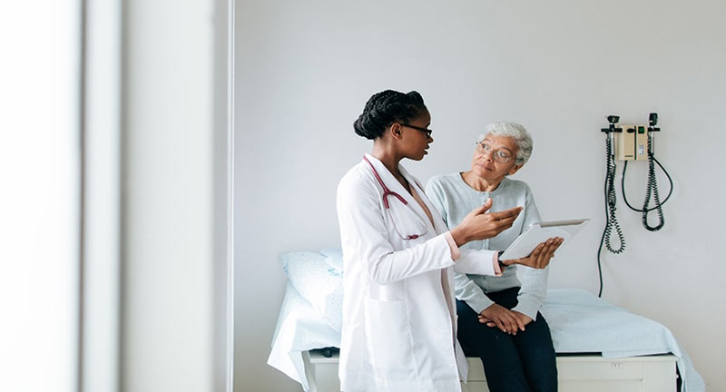 A provider explaining a document to a patient