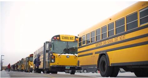 School buses lined up on street